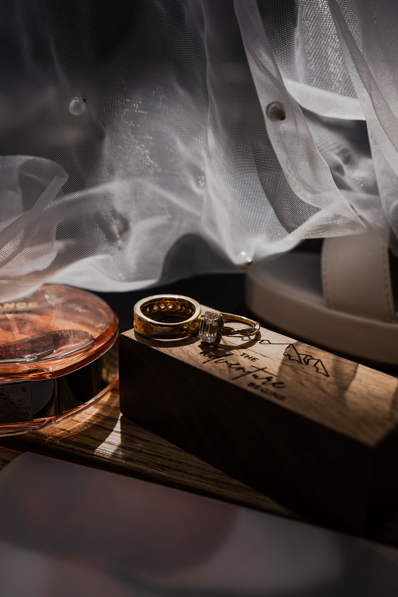 Wedding rings and personal details in moody light